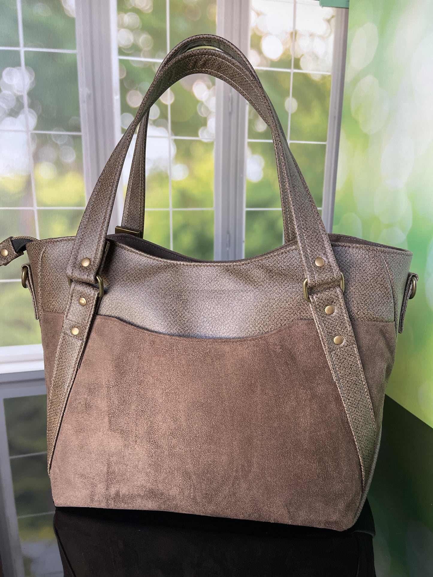 Brown faux leather and faux suede Handbag with matching zipper pouch.