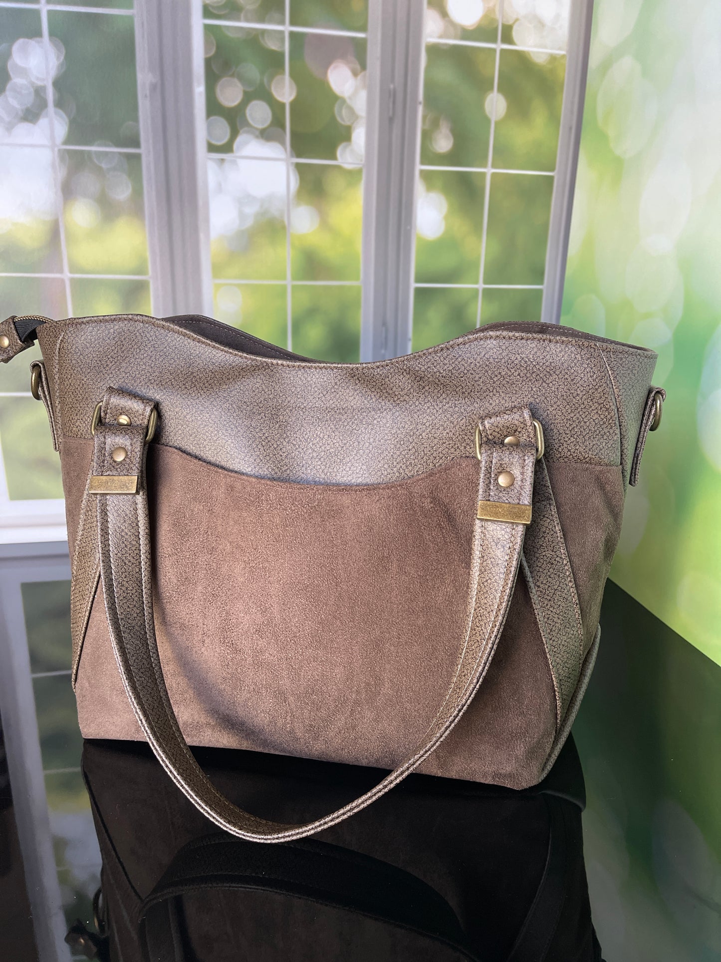 Brown faux leather and faux suede Handbag with matching zipper pouch.