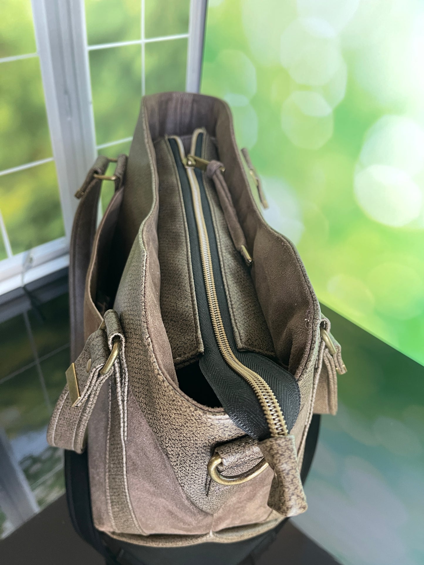 Brown faux leather and faux suede Handbag with matching zipper pouch.